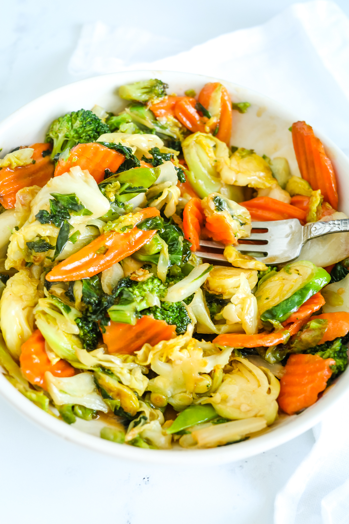 a bowl of vegetables with sauce