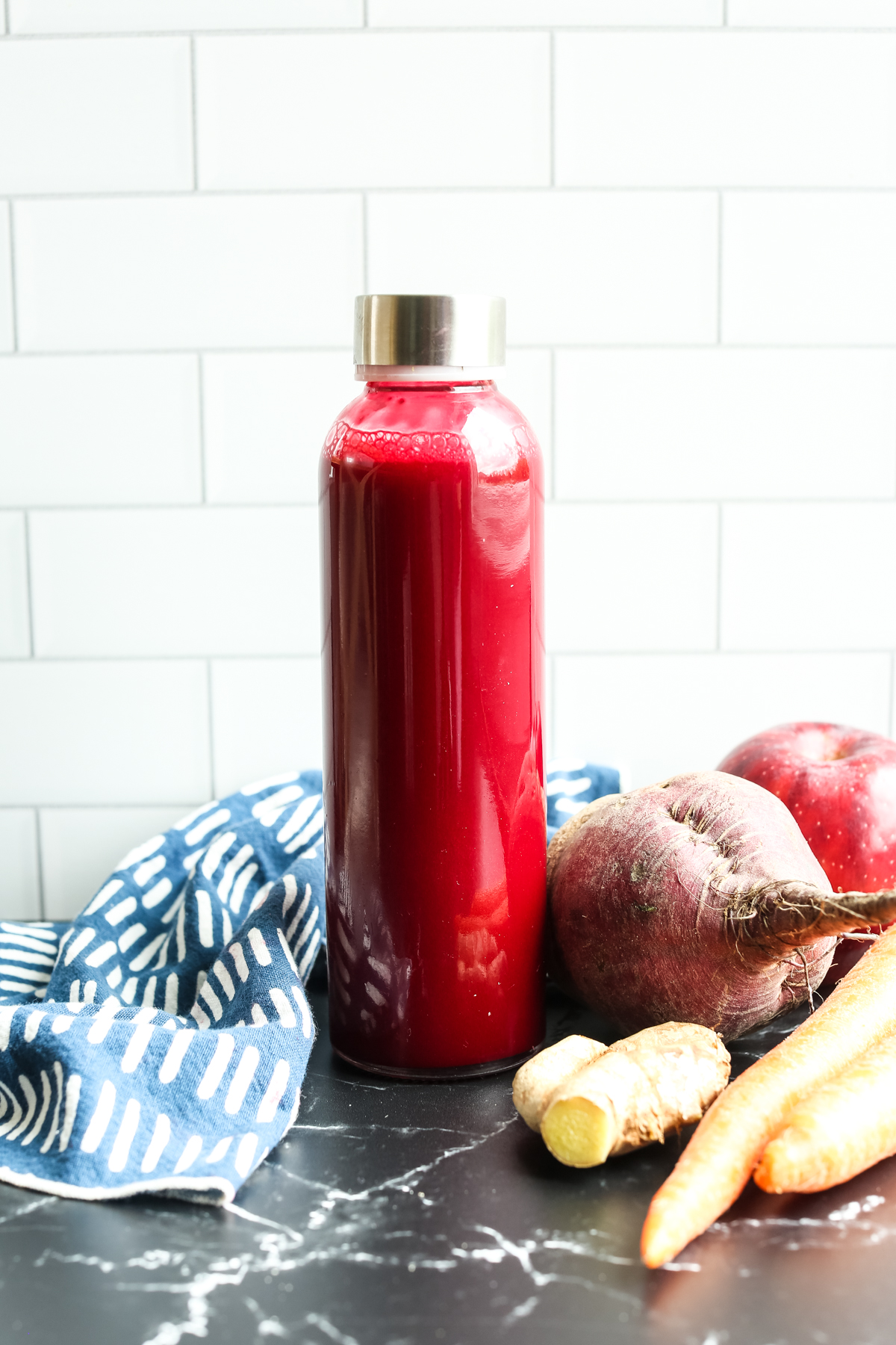 ABC juice in a long skinny glass container