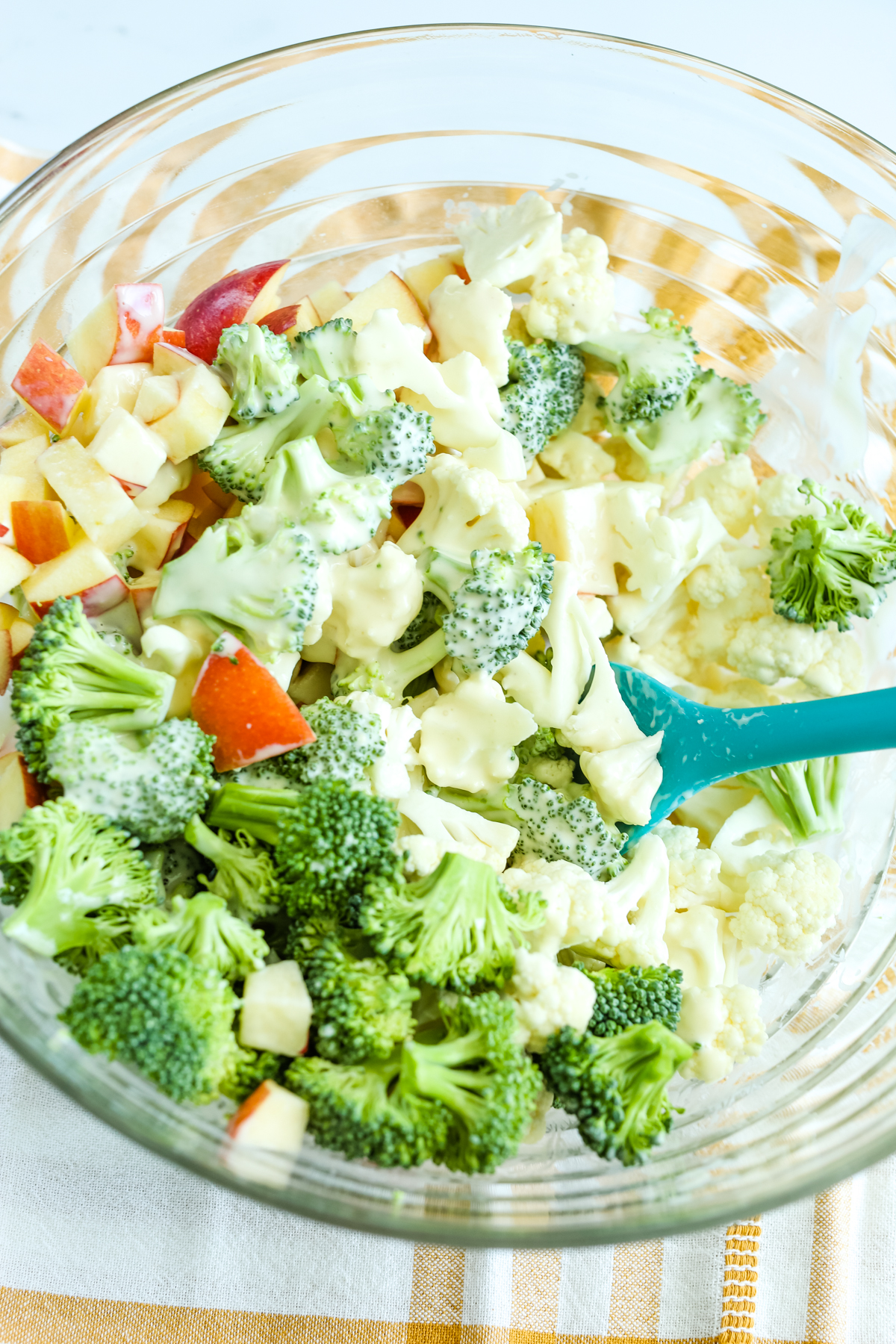 stirring together ingredients with a blue spoon