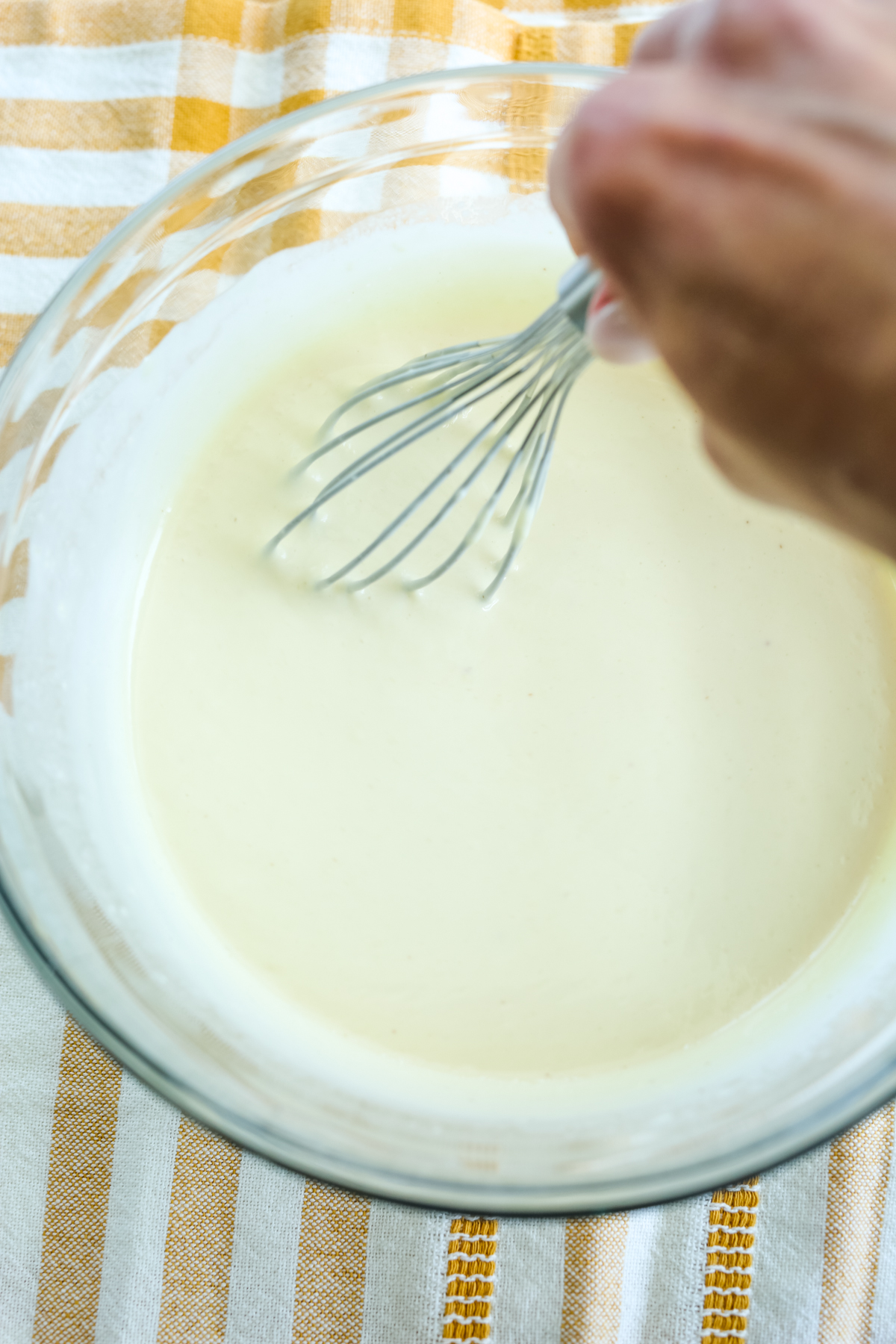 whisked together dressing in a glass bowl