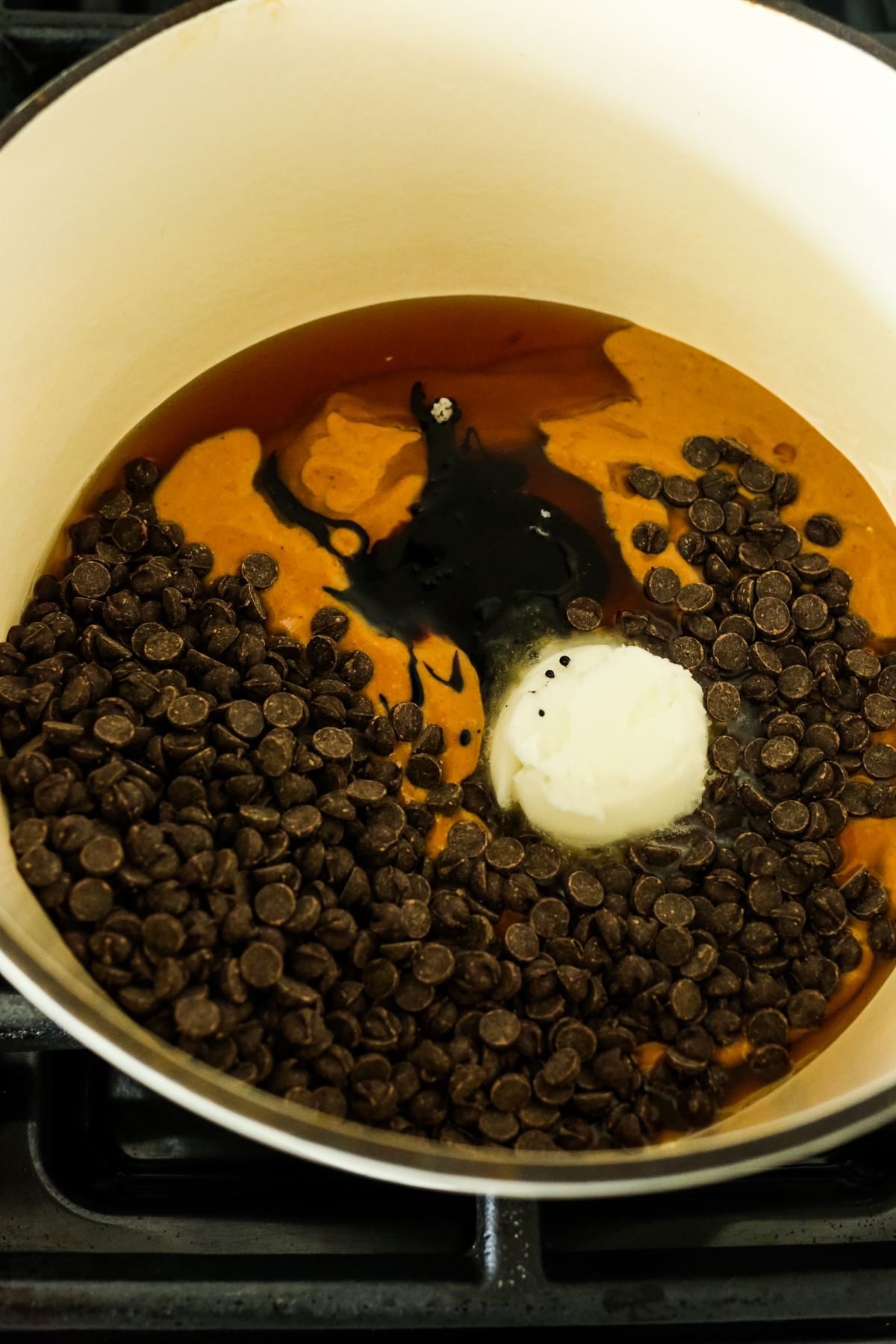 peanut butter, coconut oil, and chocolate chips in a pot