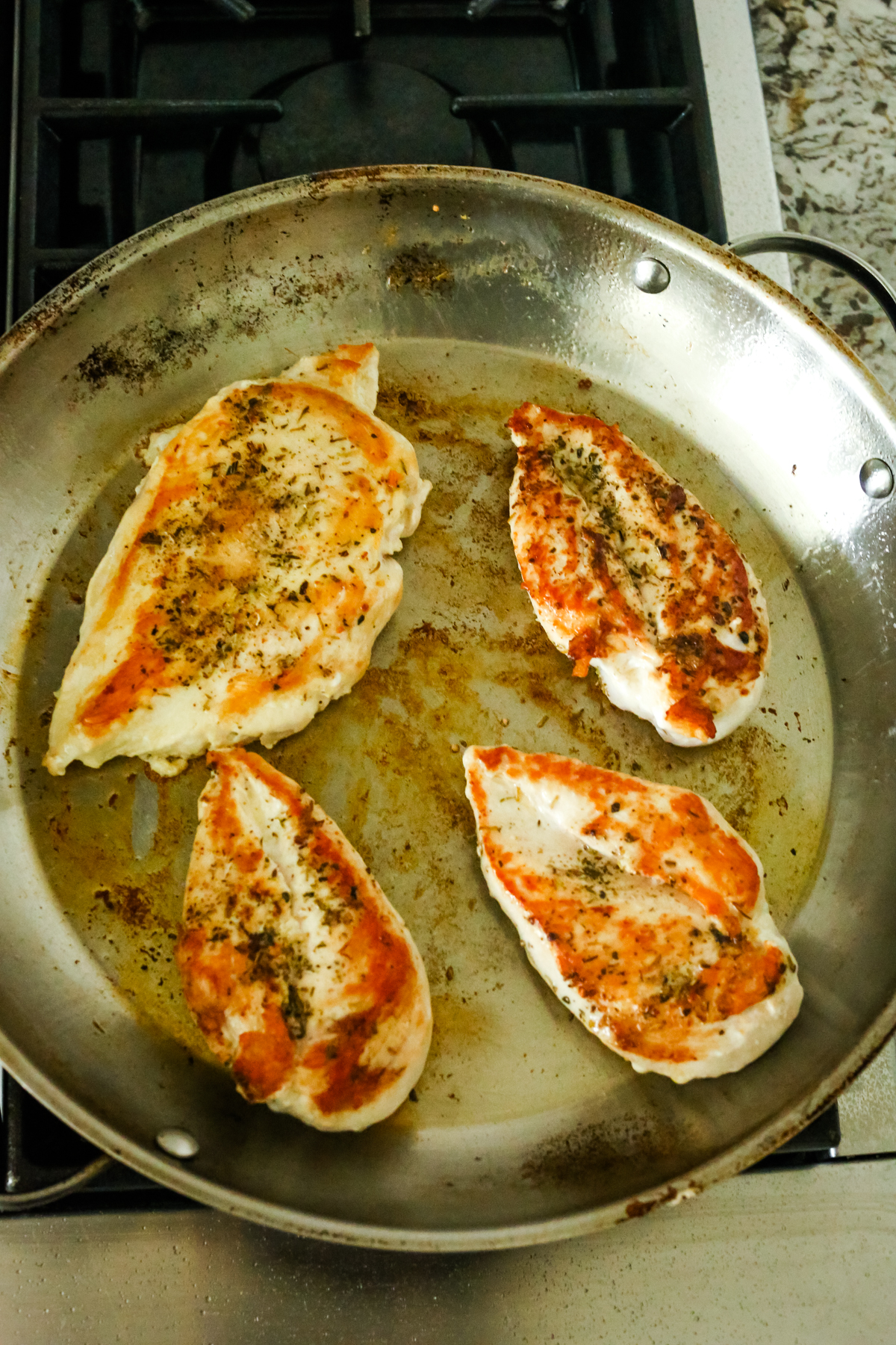 golden chicken breast in a pan