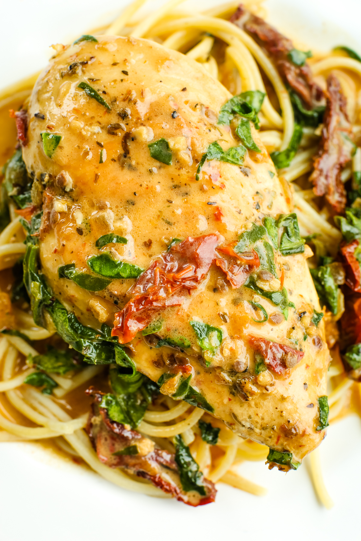 Dairy Free Tuscan Chicken on a plate with pasta