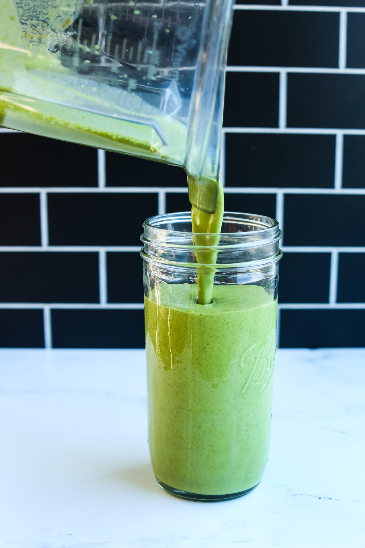 Green Power Smoothie being poured in a glass