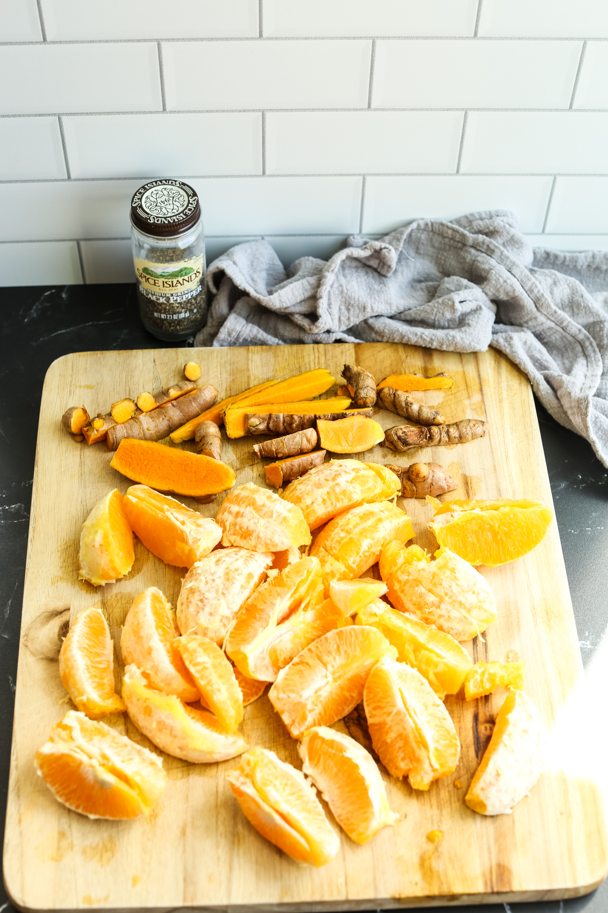orange segments and fresh turmeric root