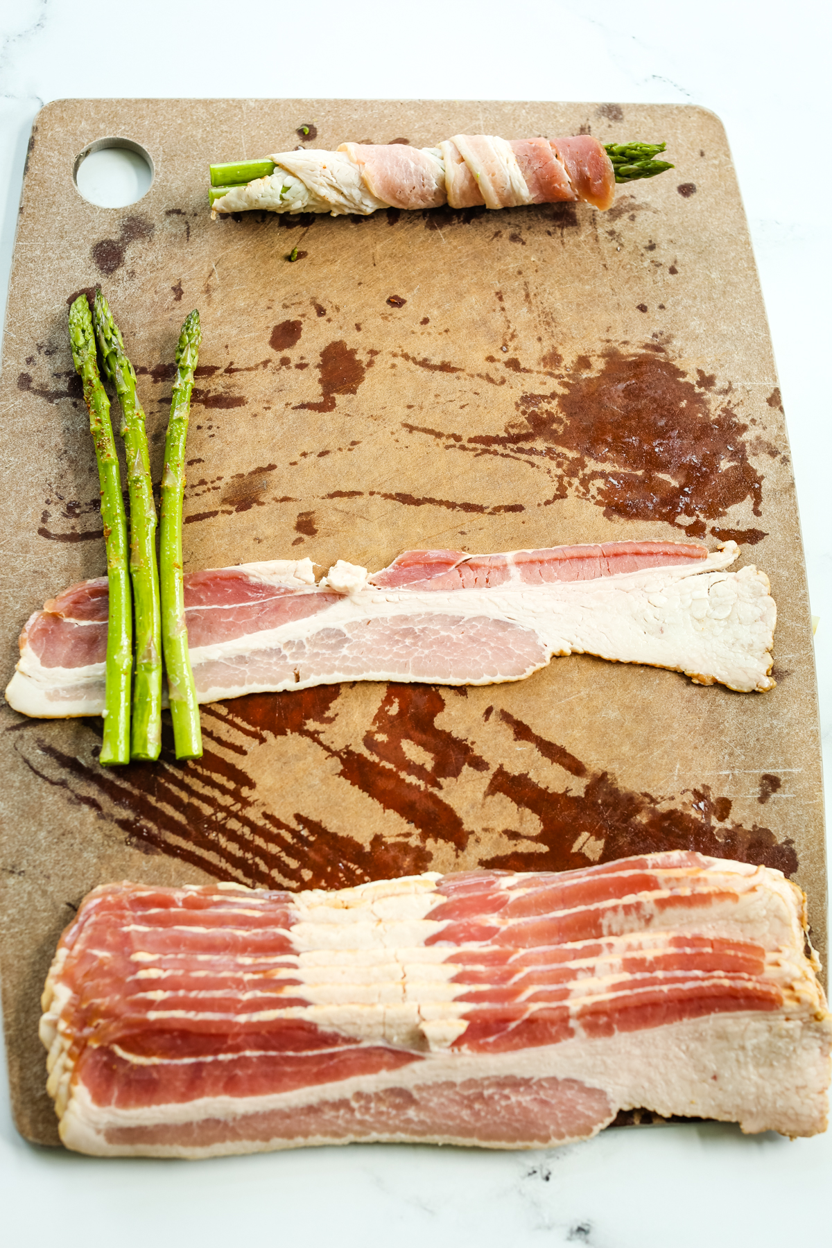 wrapping bacon around 3 asparagus spears