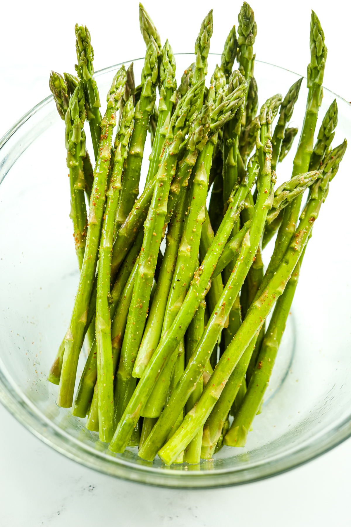 asparagus stalks in a glass bowl