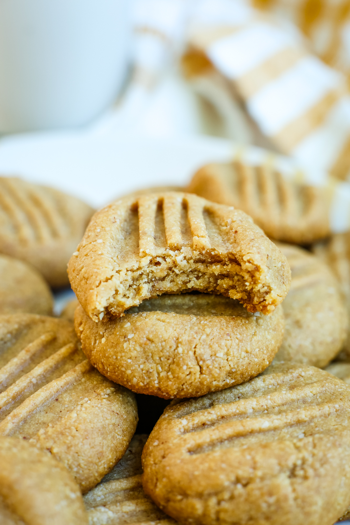 Almond Flour Peanut Butter Cookies with a bite out of the one on top