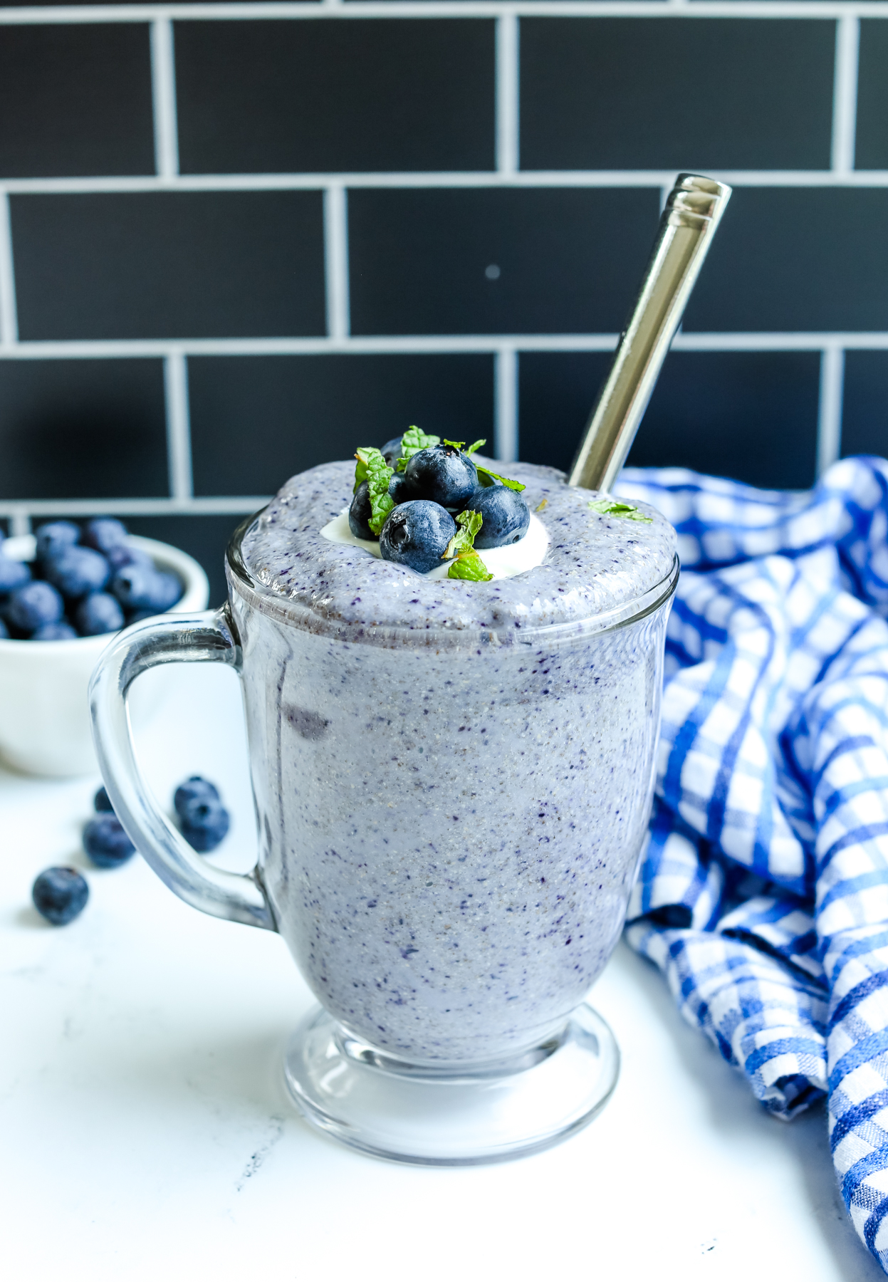 Blueberry Chia Pudding recipe in a glass mug with fresh blueberries on top