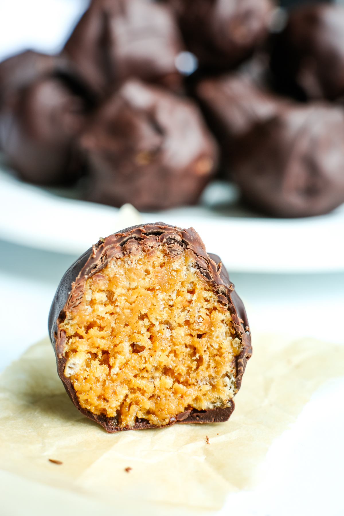 the inside of one of the peanut butter balls with Rice Krispies