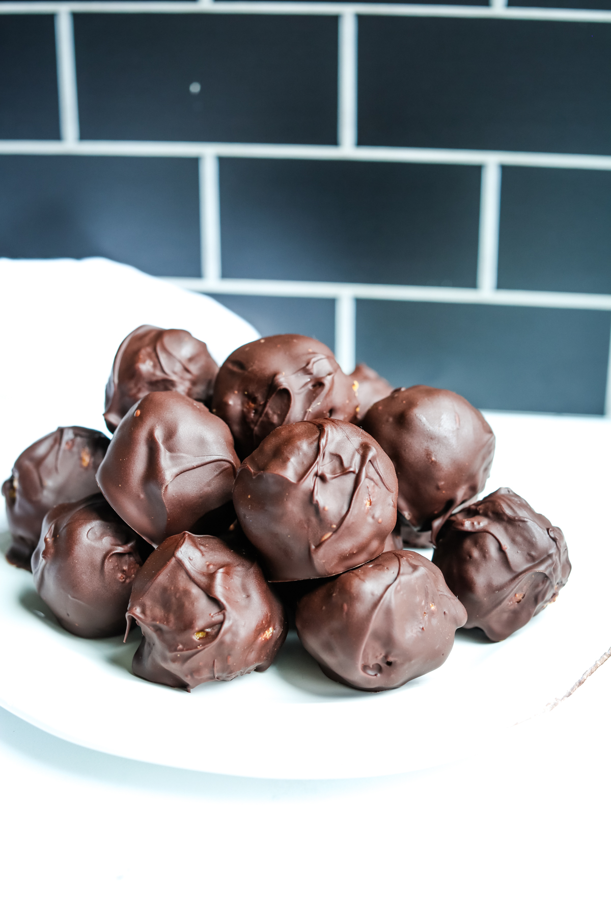 a plate of peanut butter balls with Rice Krispies
