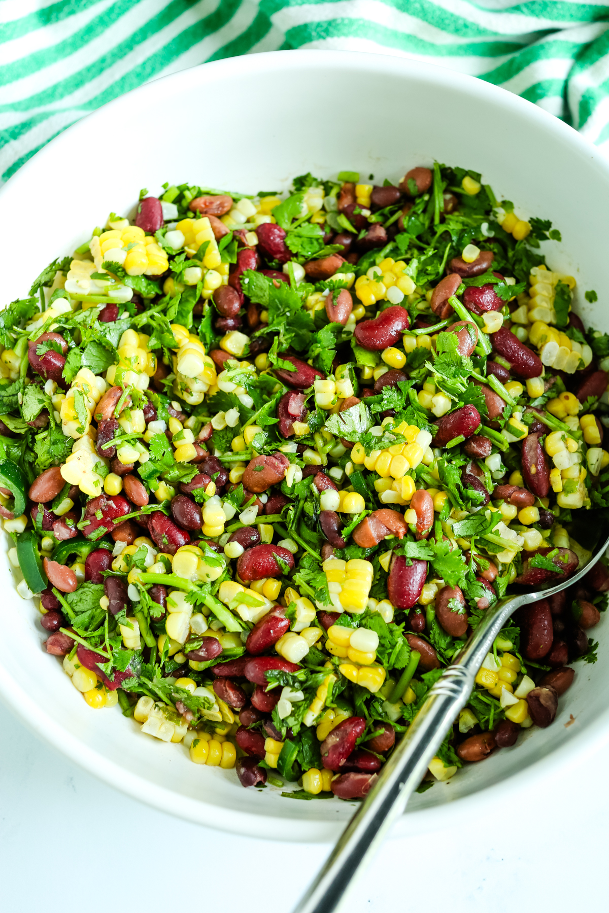 Bean salad in a bowl with spoon