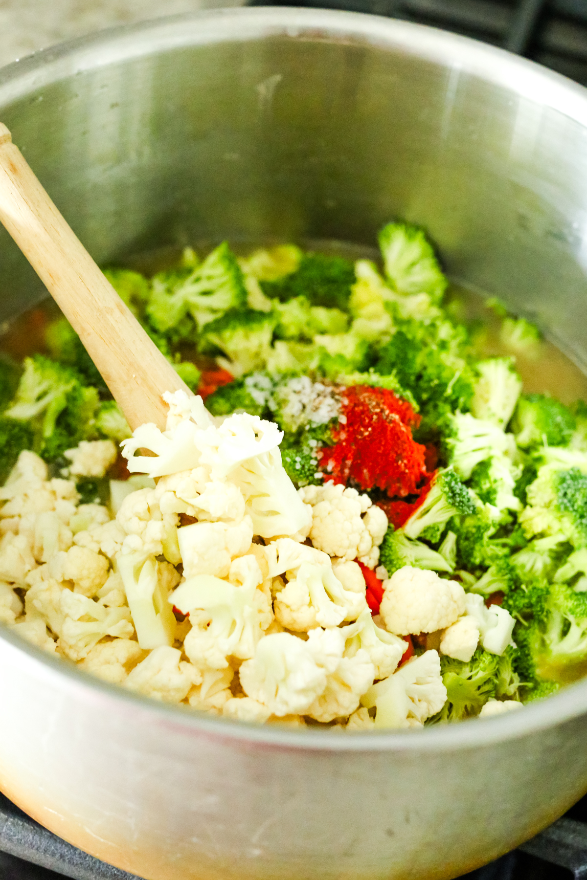 cauliflower, broccoli, and spices in a big stockpot
