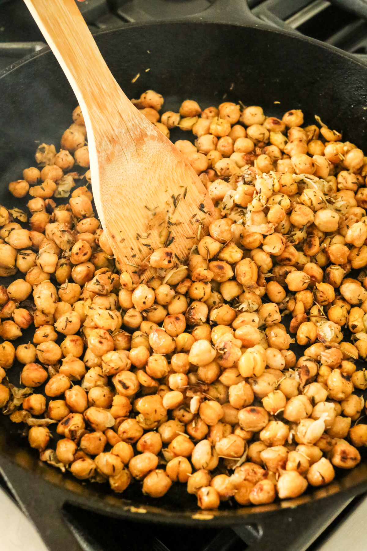 a black cast iron skillet with chickpeas