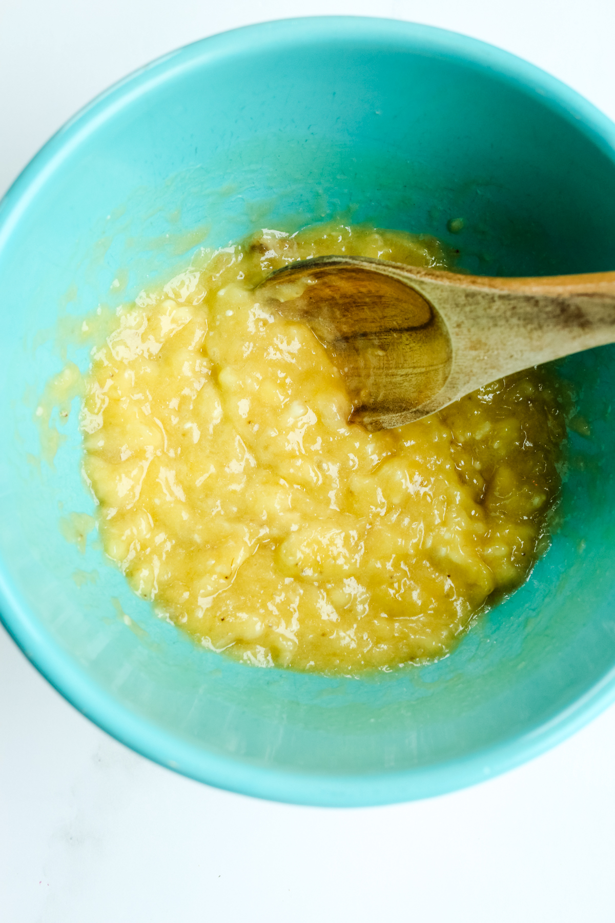 mashed banana in a blue bowl