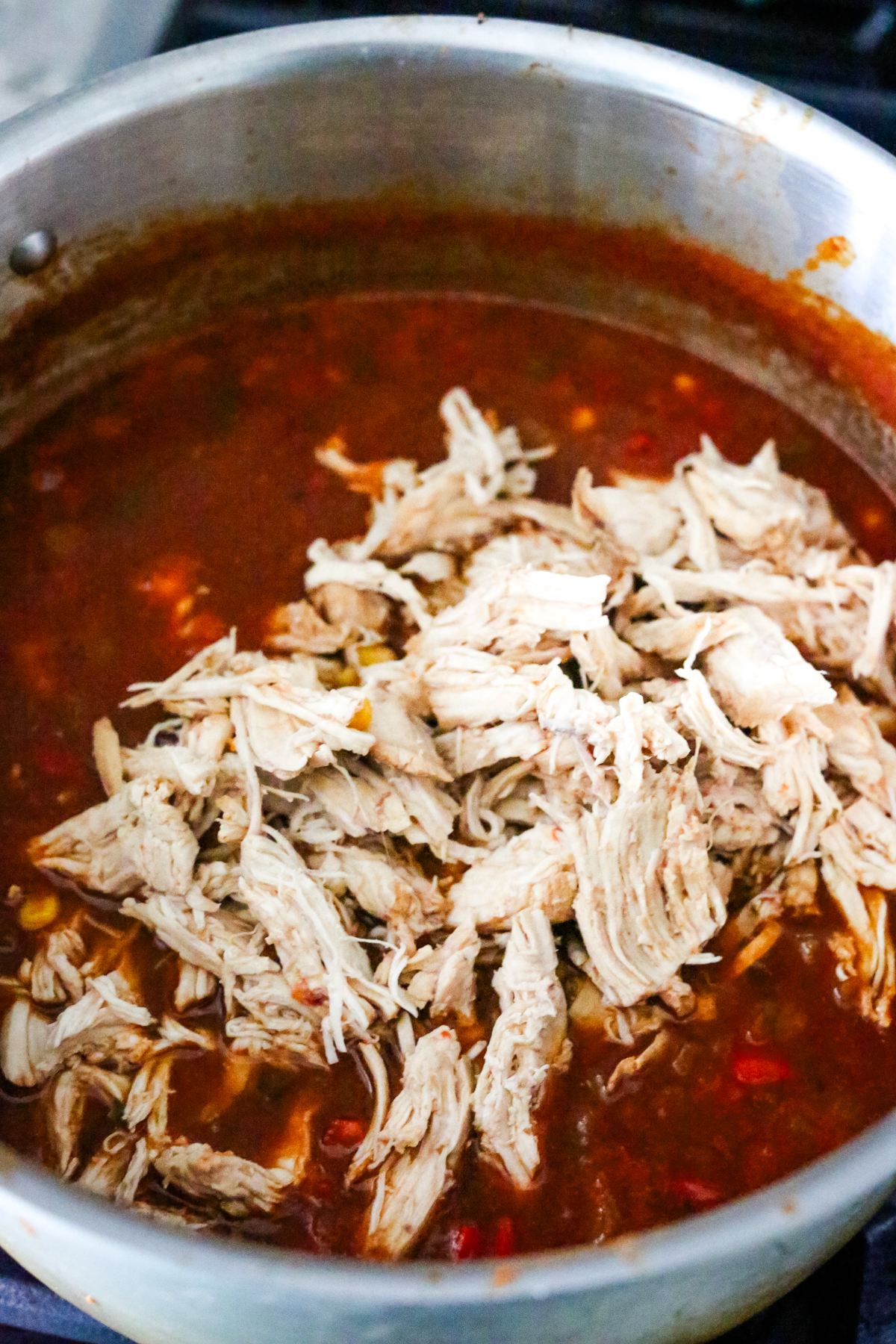 adding shredded chicken back to the pot