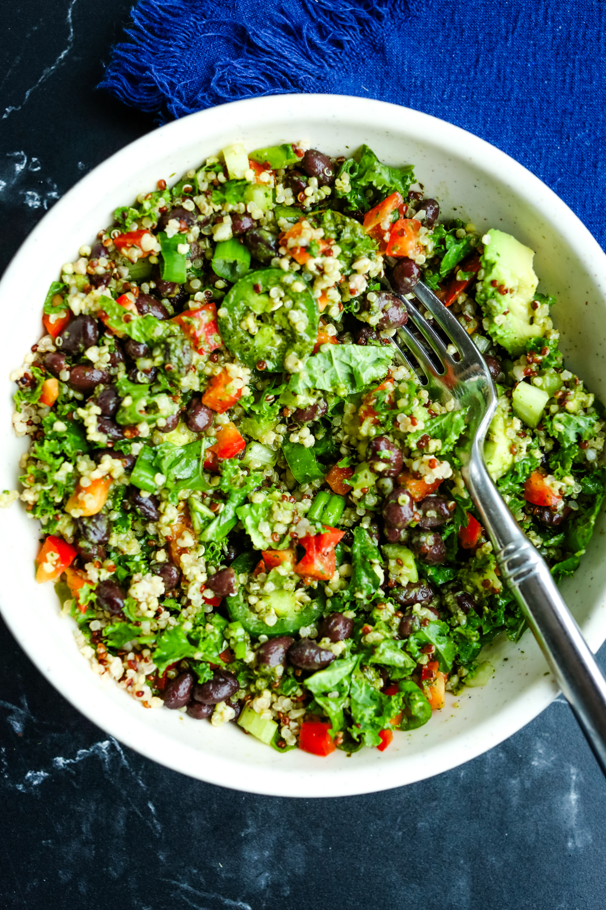 a white bowl full of fresh vegetables and beans