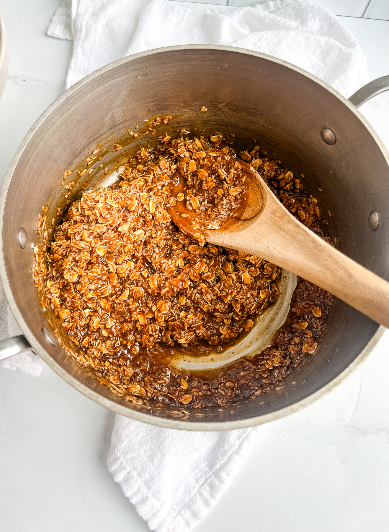 a mixture of oats and coconut in a pan