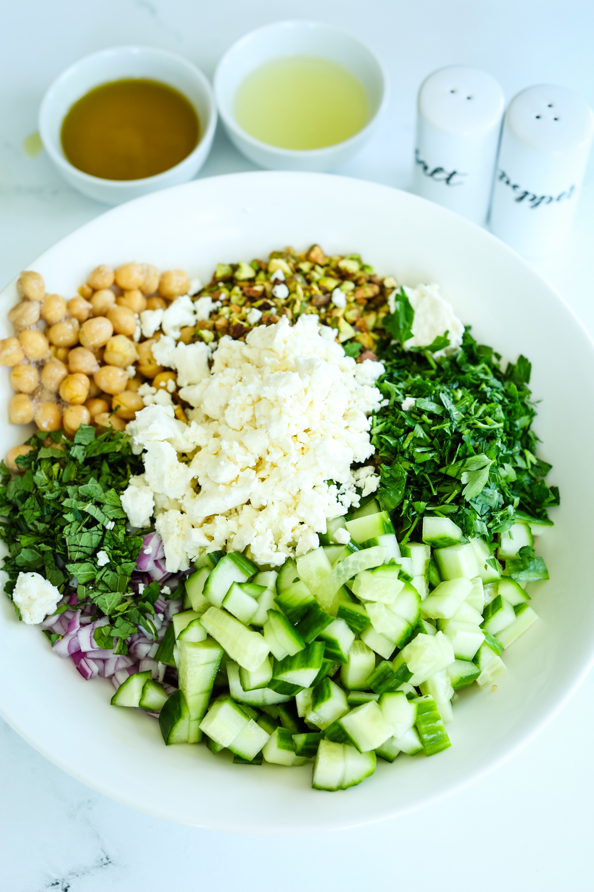 all of the ingredients of the salad in a bowl but not tossed together yet. 