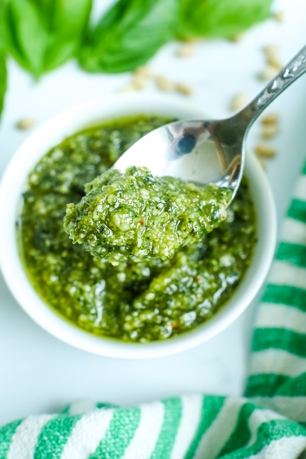 basil pesto with a spoon 