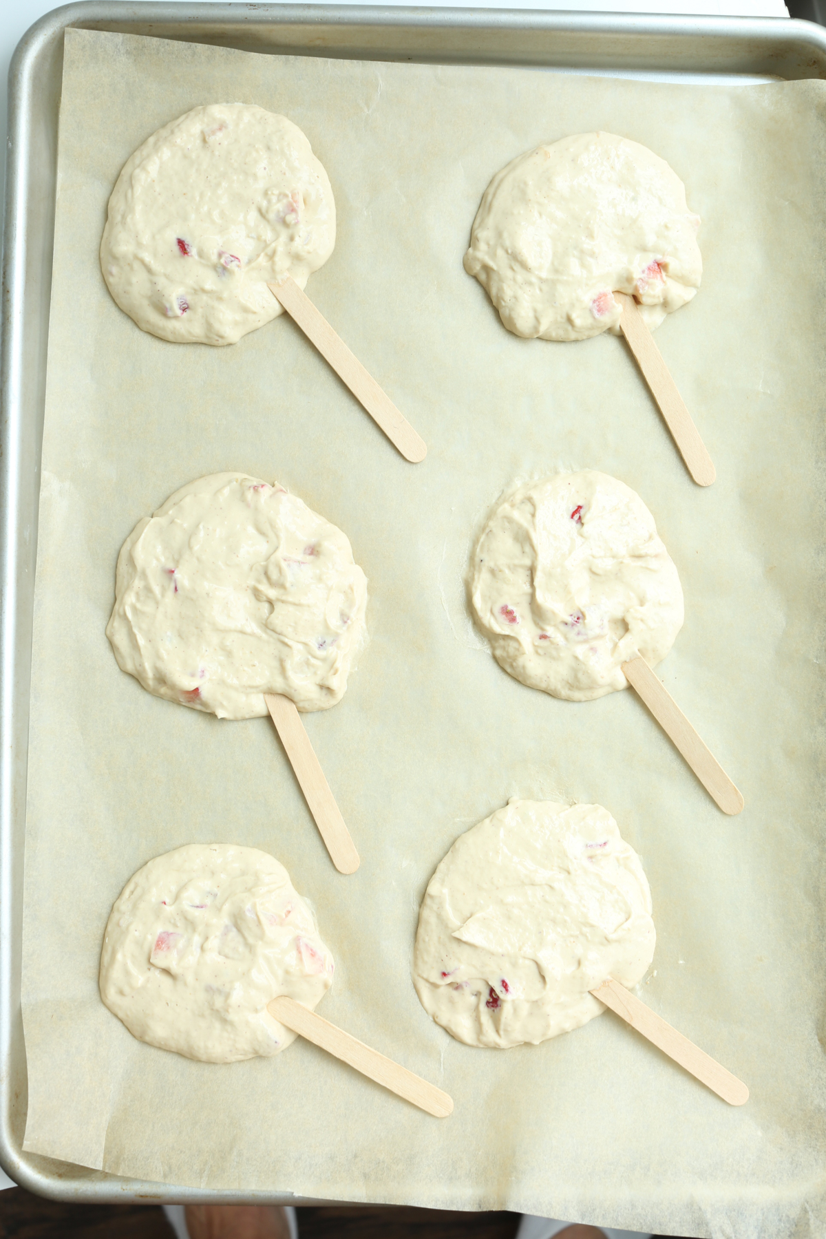 Greek yogurt bars on a tray with sticks