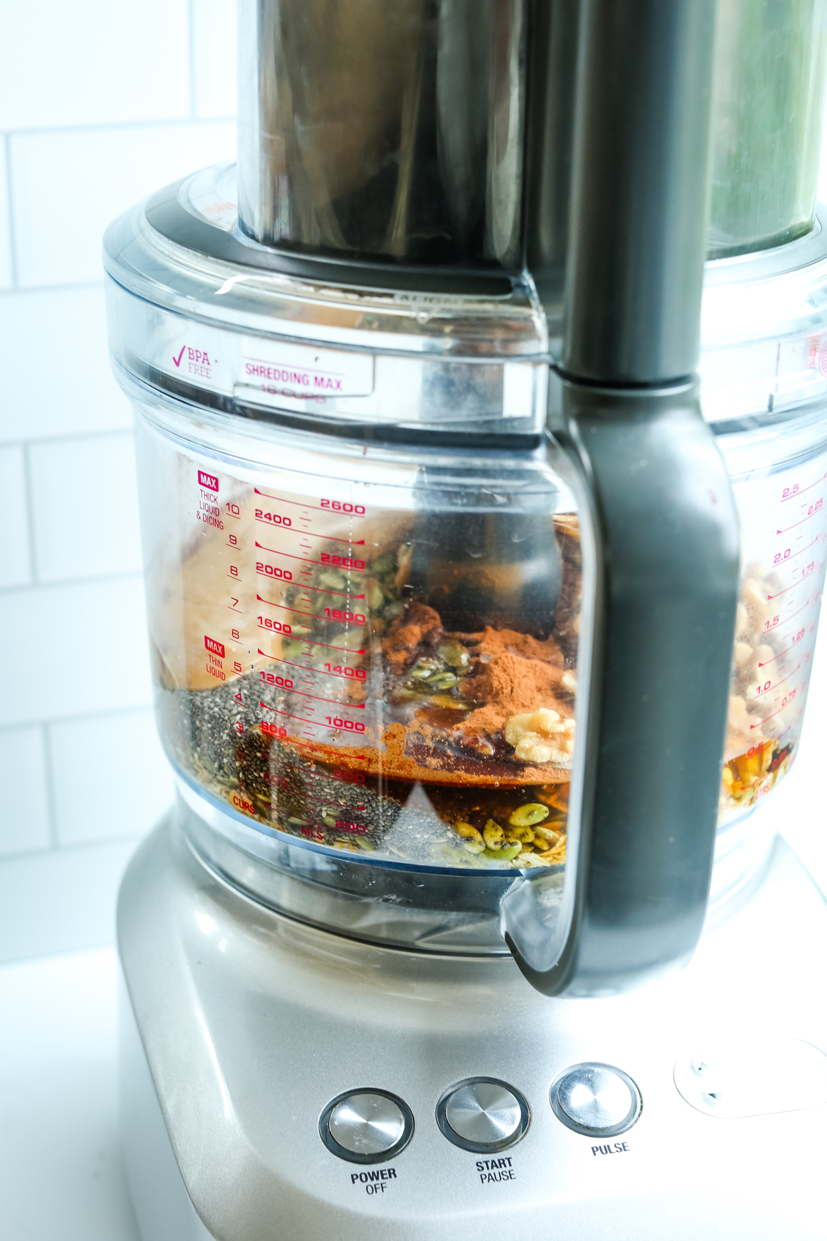 walnuts, dates, and other ingredients in a food processor before combining 