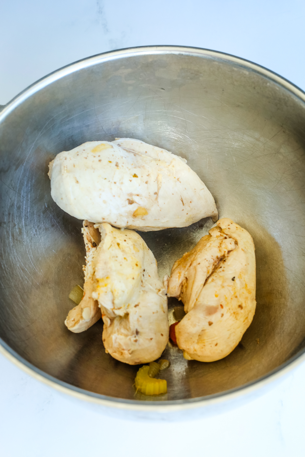 cooked chicken breasts in a bowl 