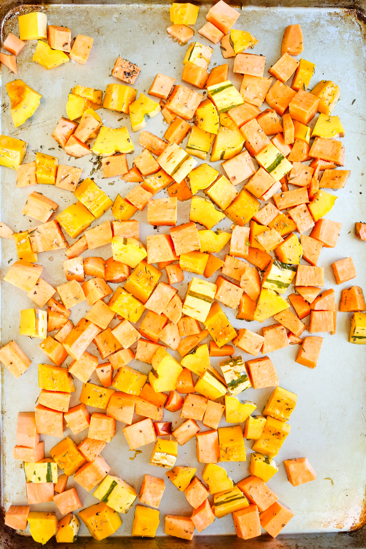 sweet potato and delicate squash on a sheet pan