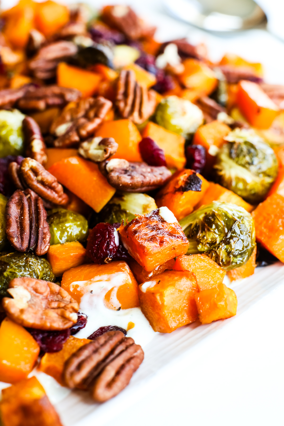 autumn roasted vegetables with yogurt on a platter
