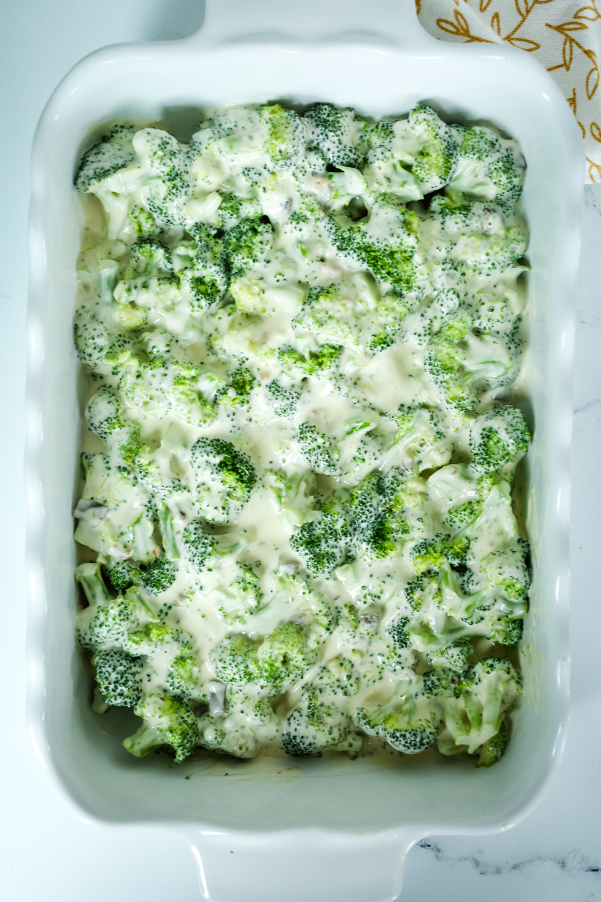 broccoli mixed with a creamy mixture
