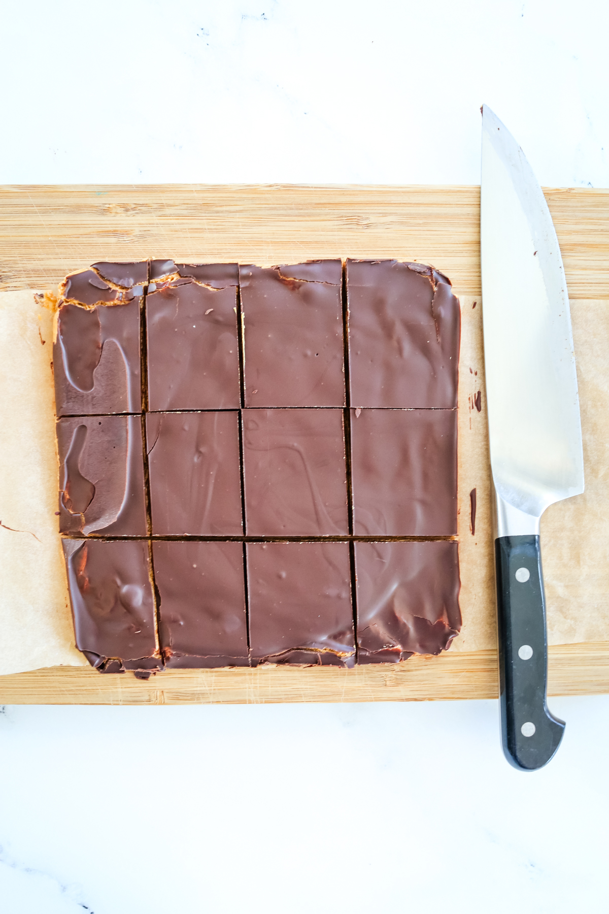 slicing chocolate peanut butter protein bars