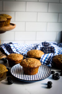 Cottage Cheese Blueberry Muffins scattered