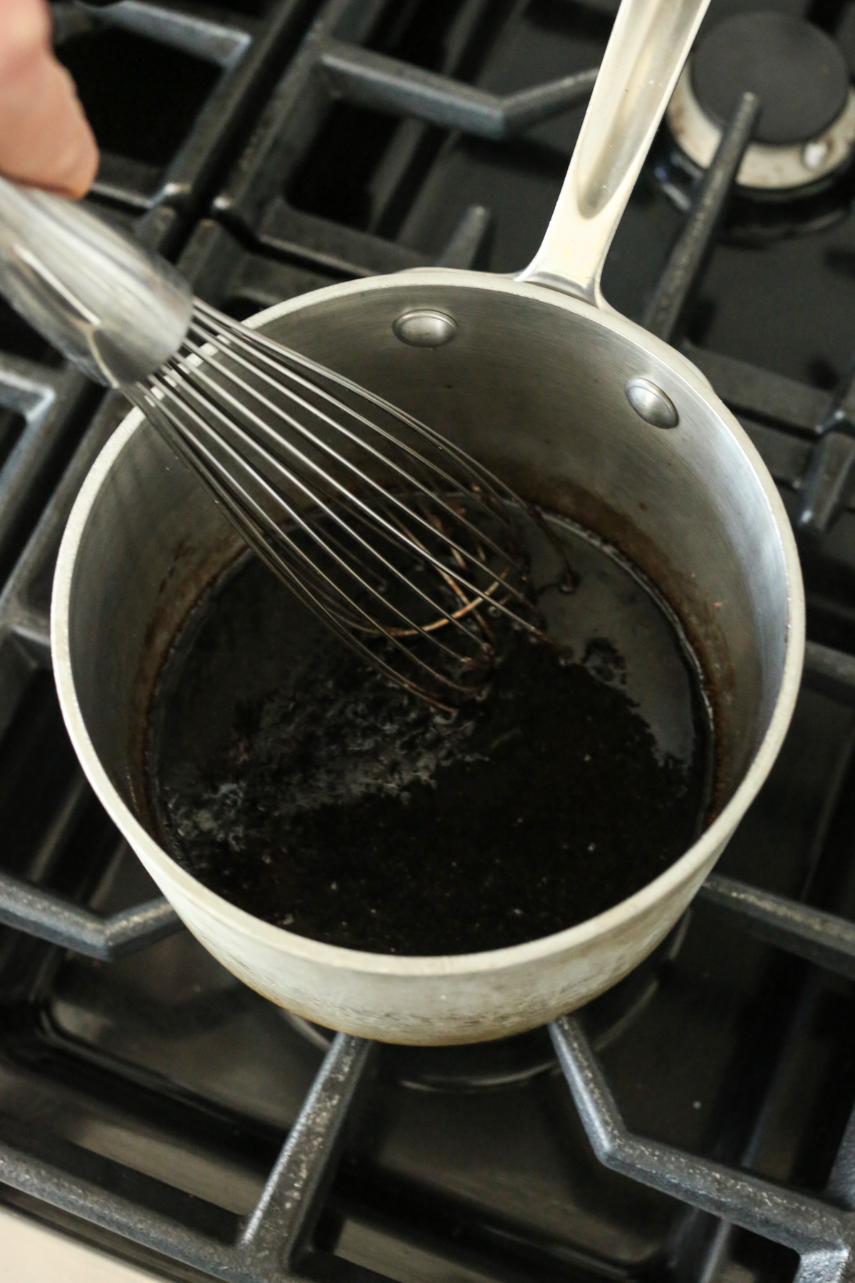 whisking gelatin into elderberry syrup 