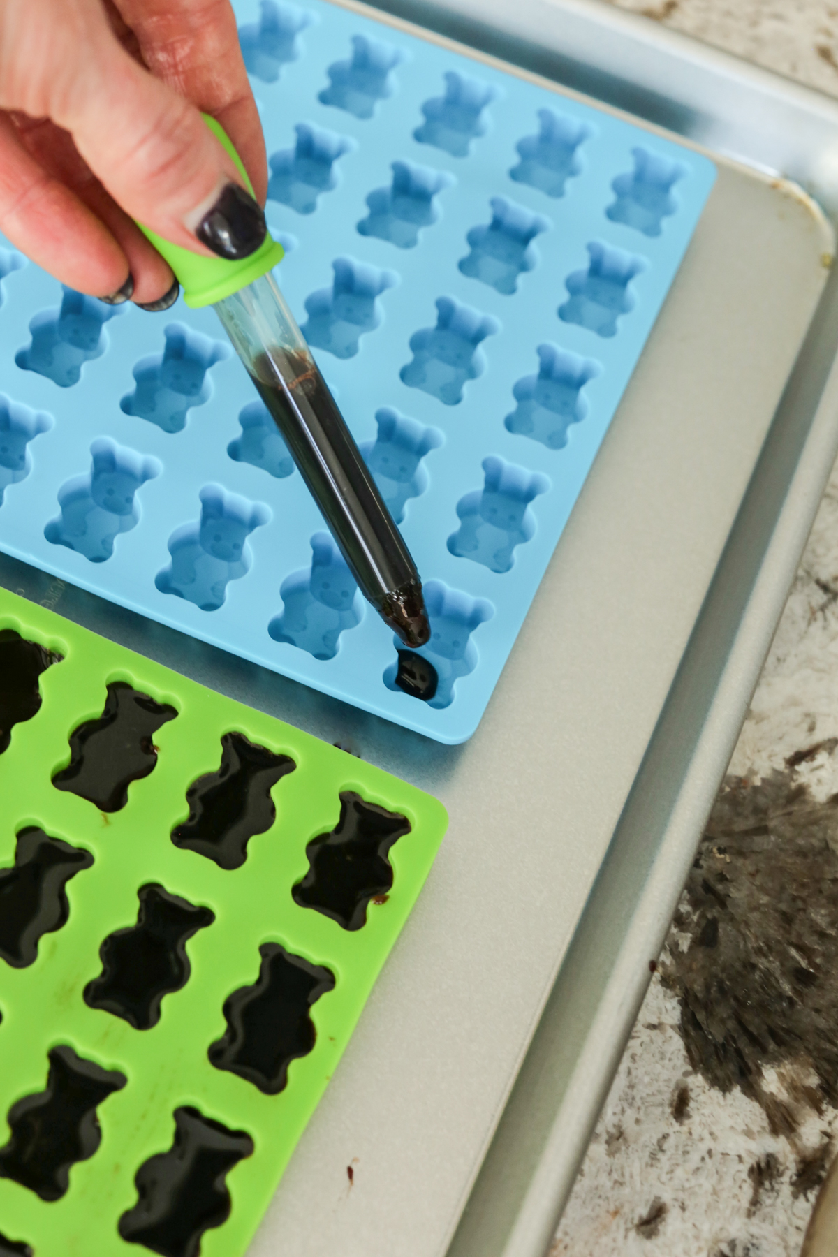 making elderberry gummies by putting syrup in a gummy molds