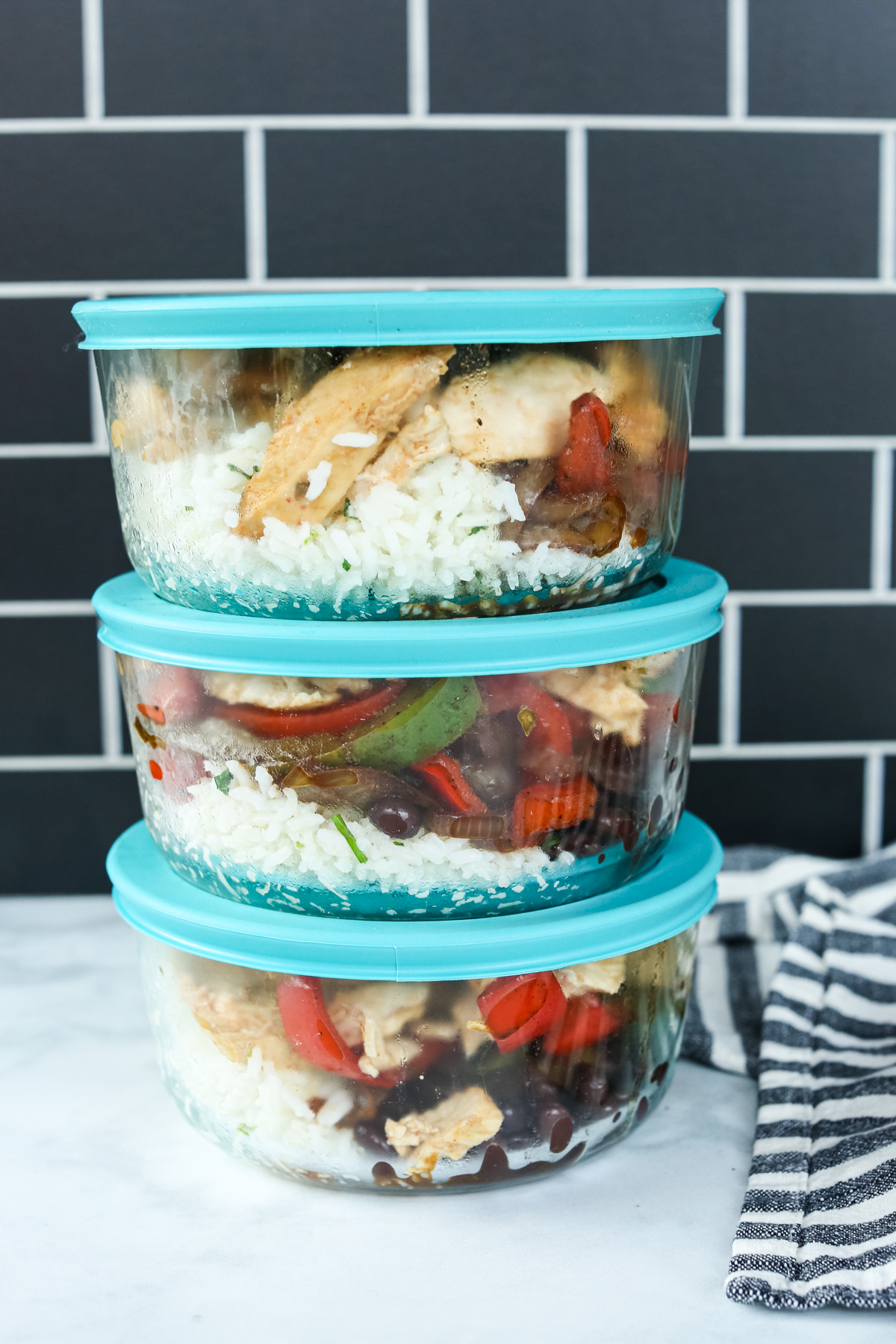 chicken fajita bowls in meal prep containers for storage
