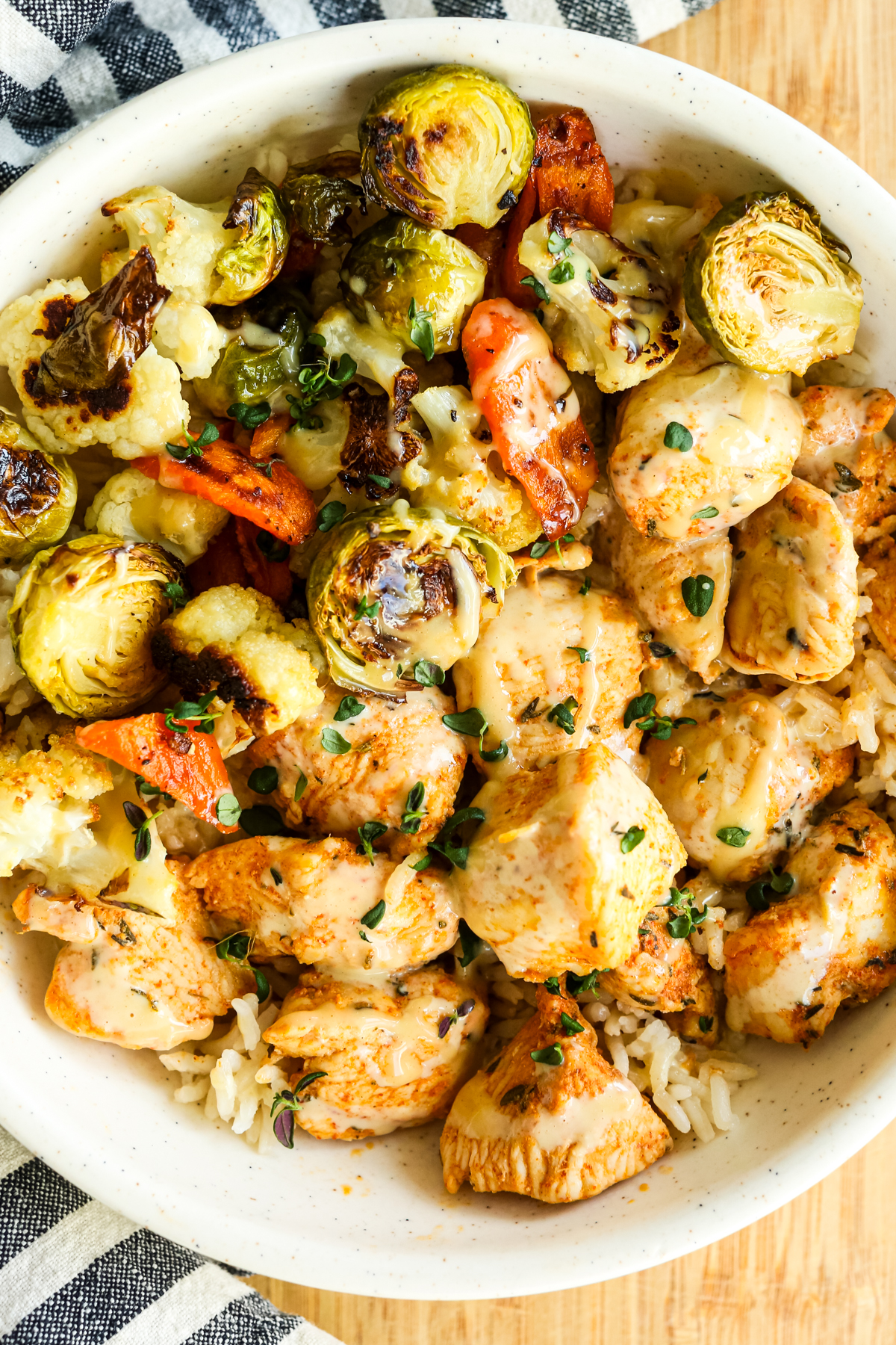 chicken and rice bowl with a striped napkin