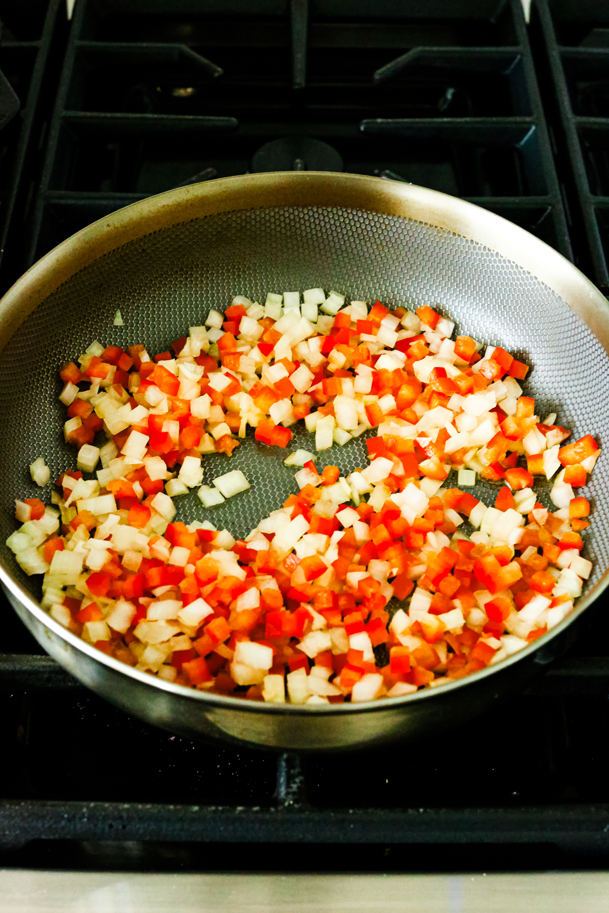 peppers and onions in a skillet 