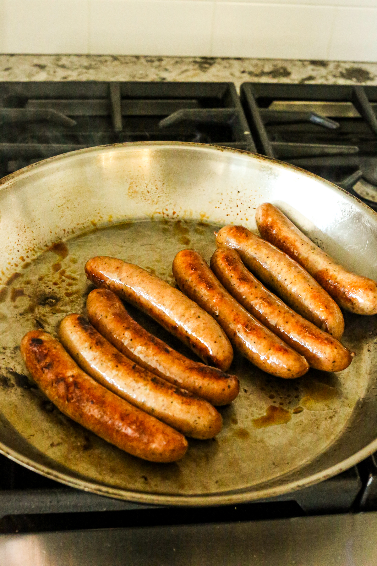 chicken sausage links in a large skillet