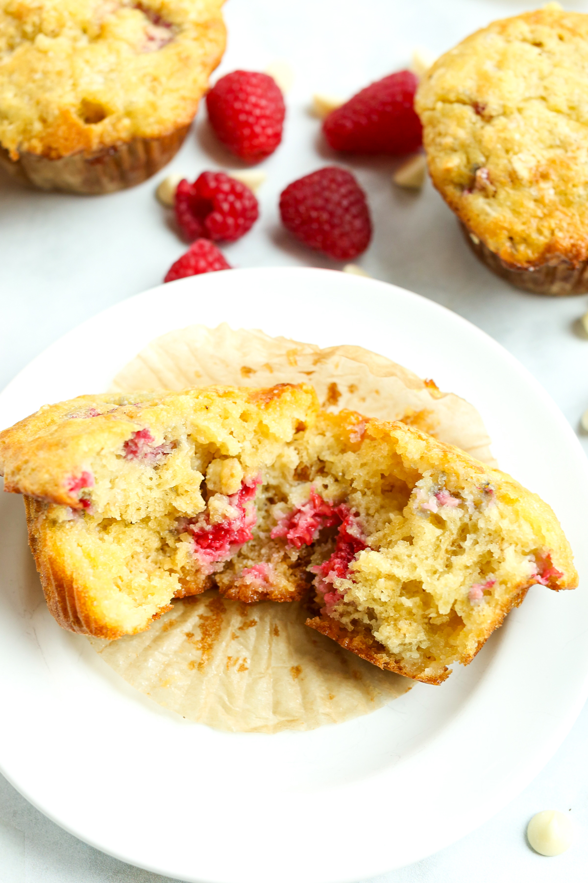 showing the inside texture of the raspberry white chocolate muffins