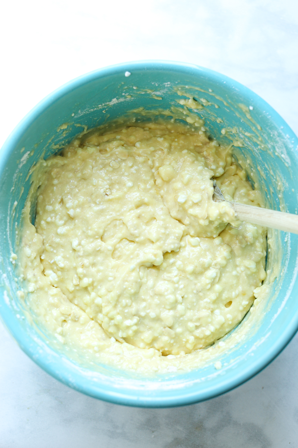 a bowl of batter with a spoon