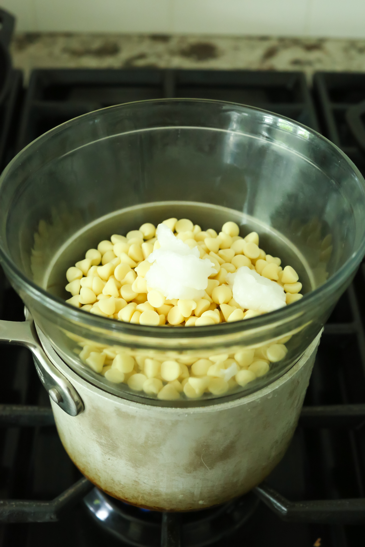melting white chocolate chips using a double boiler on the stovetop