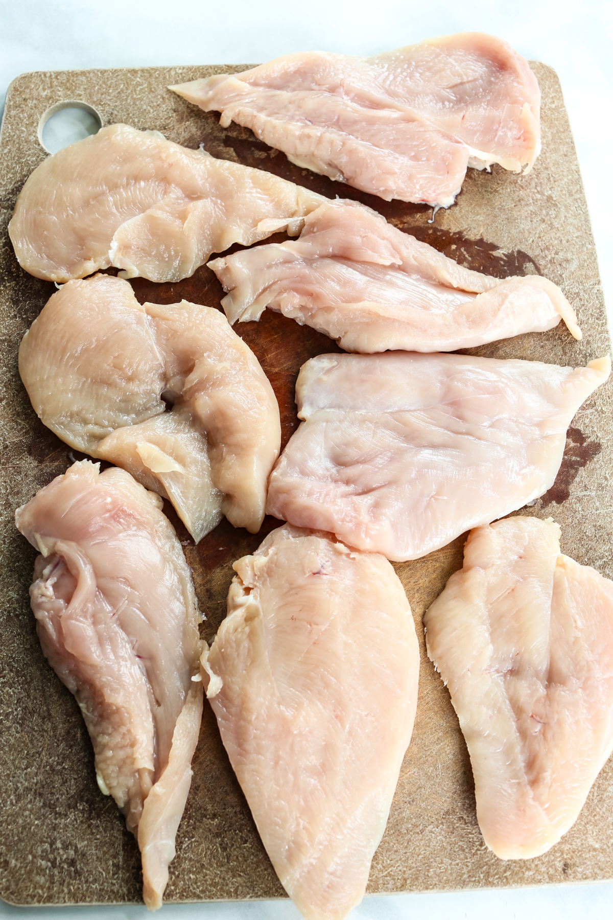 chicken breasts cut in half