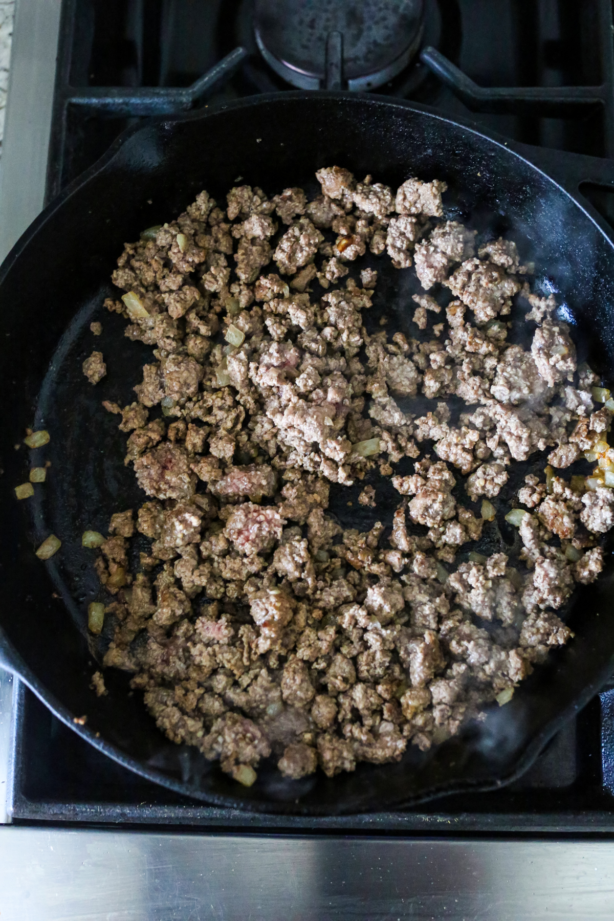 ground beef cooking in a skillet 