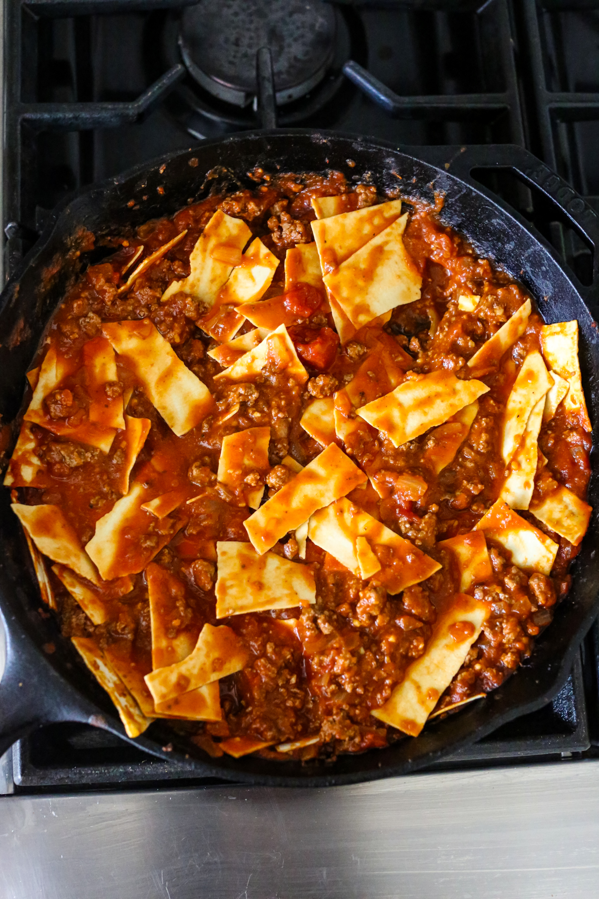 uncooked lasagna in a skillet