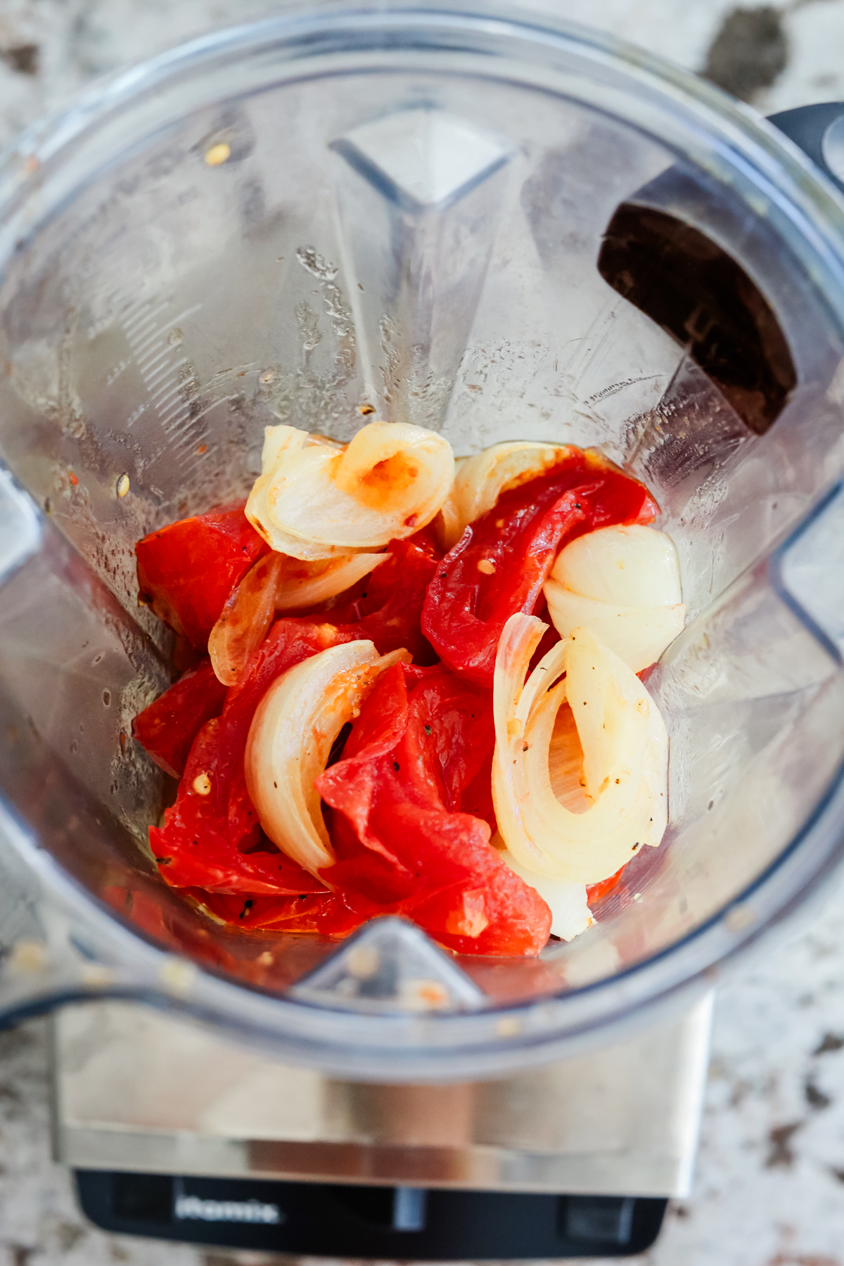 roasted tomatoes, onions, and garlic ready to be blended in a blender