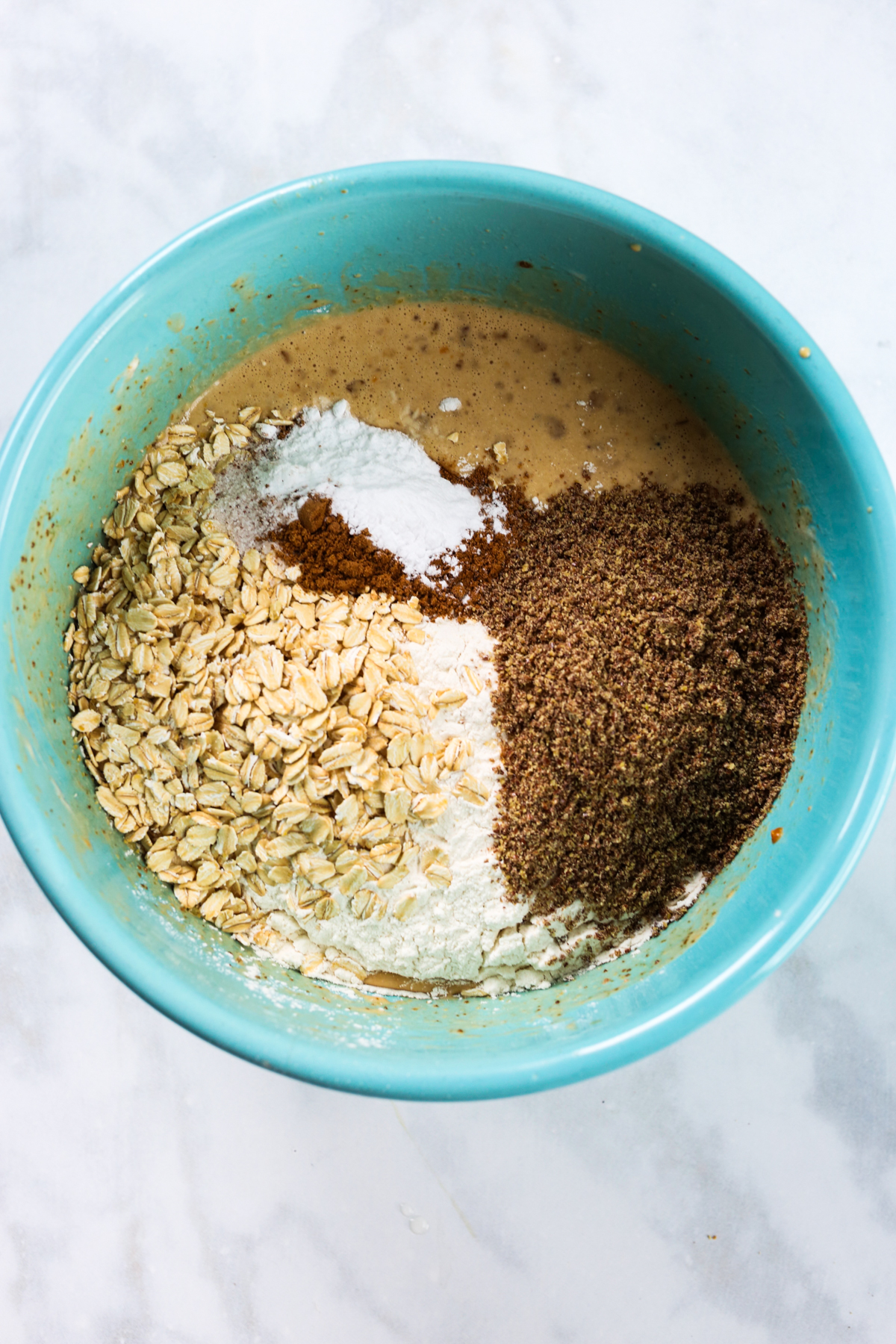 adding dry ingredients to the bowl 