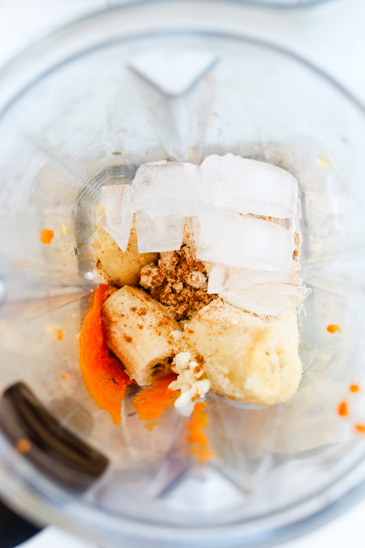 ice, banana, pumpkin puree in a blender 