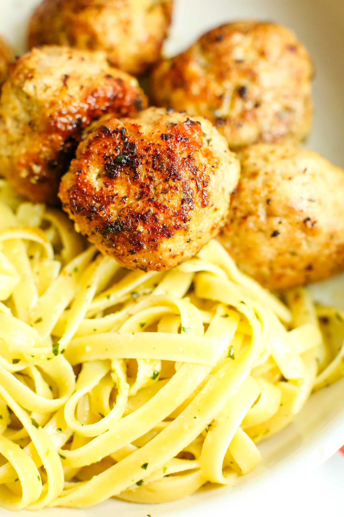 noodles and turkey meatballs in a bowl
