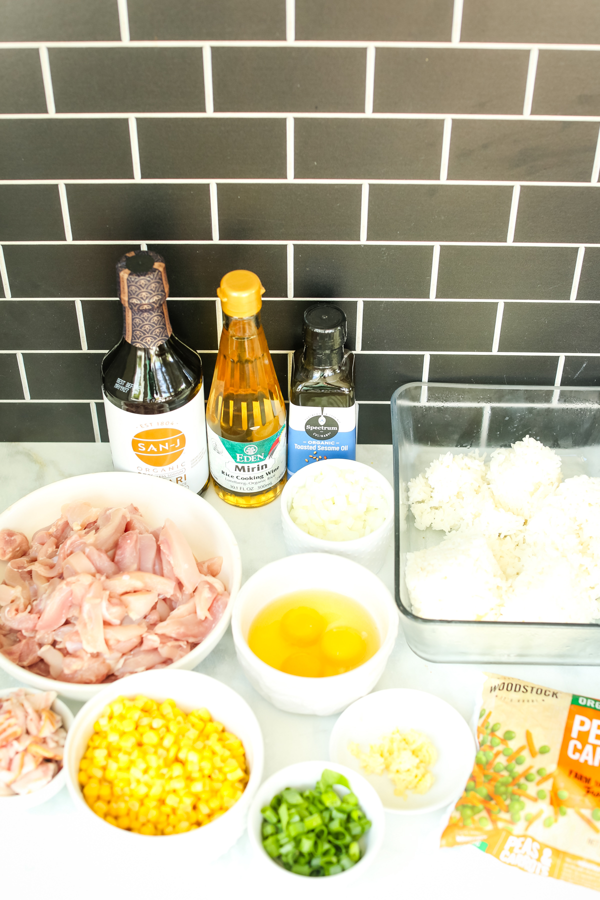 separate recipe ingredients for chicken fried rice on the counter