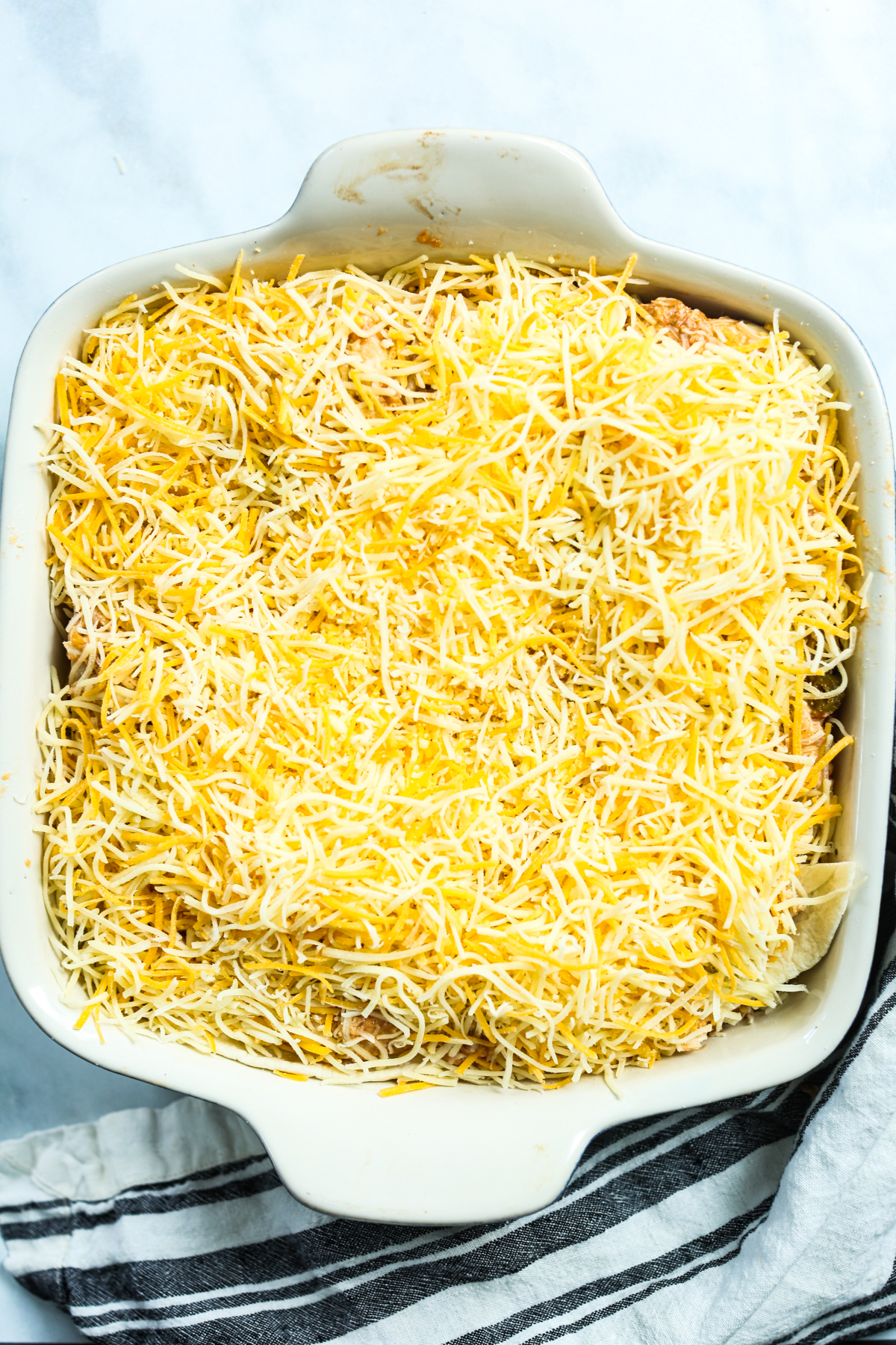 unbaked cheese in casserole dish